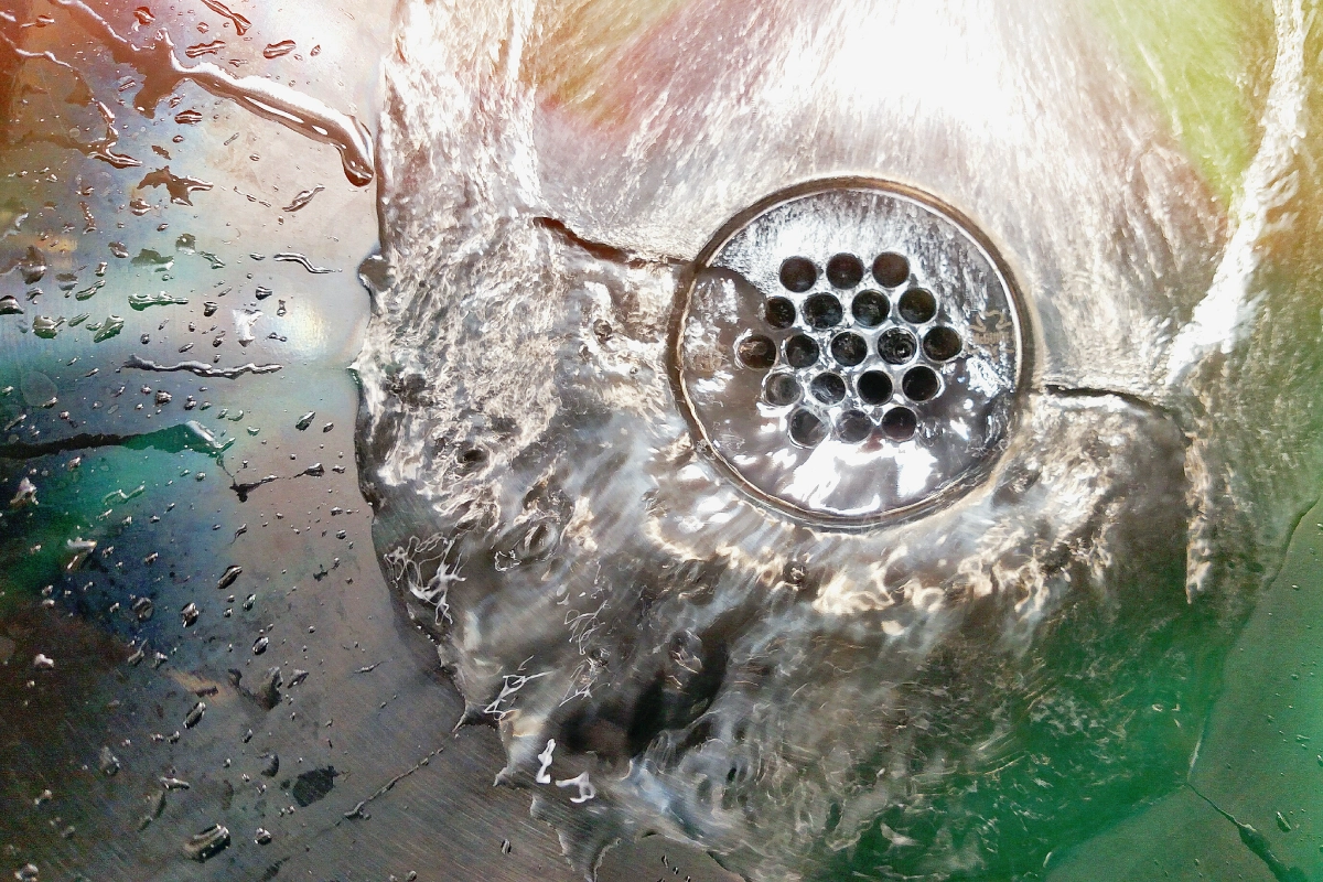 Plumber clearing a clogged drain line with professional drain cleaning equipment in Chattanooga, TN